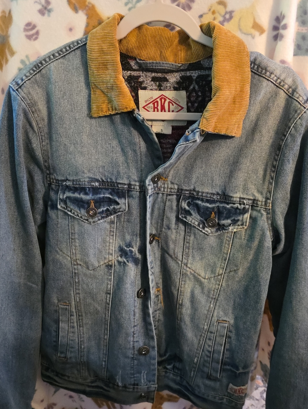 Brooklyn Cloth light-wash denim jacket features contrasting mustard yellow colla